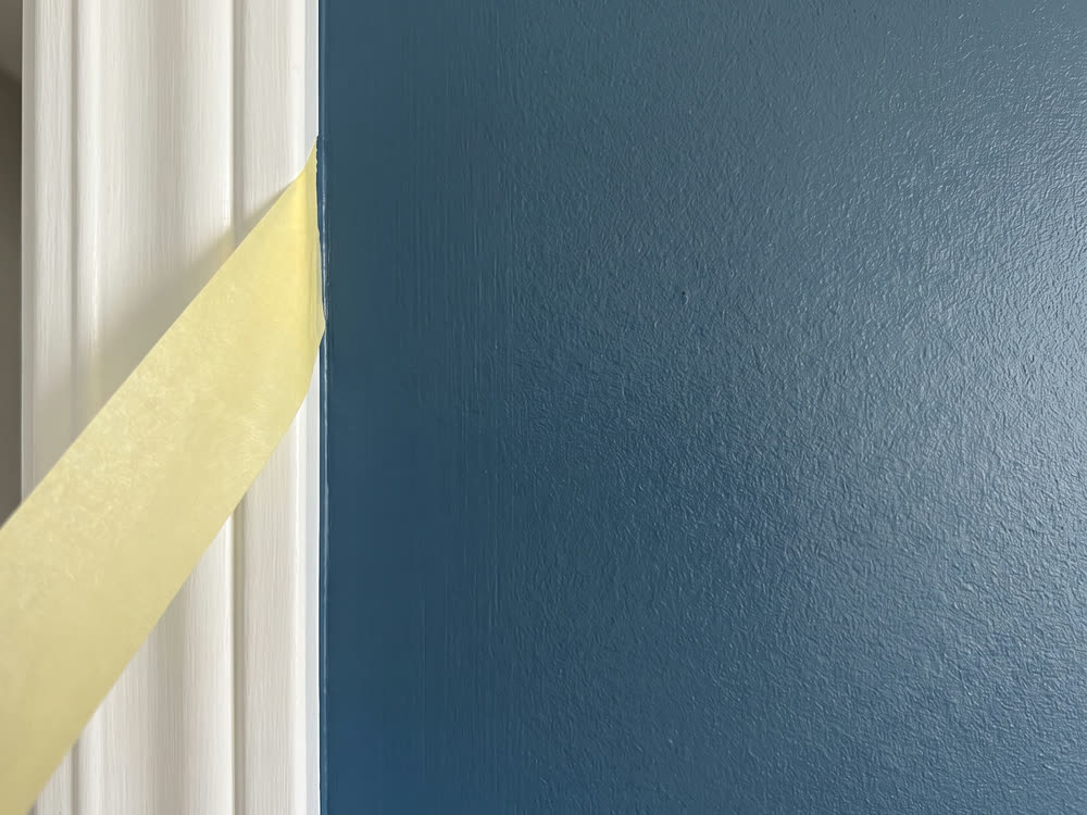 Illustration of blue paint on an inside wall.